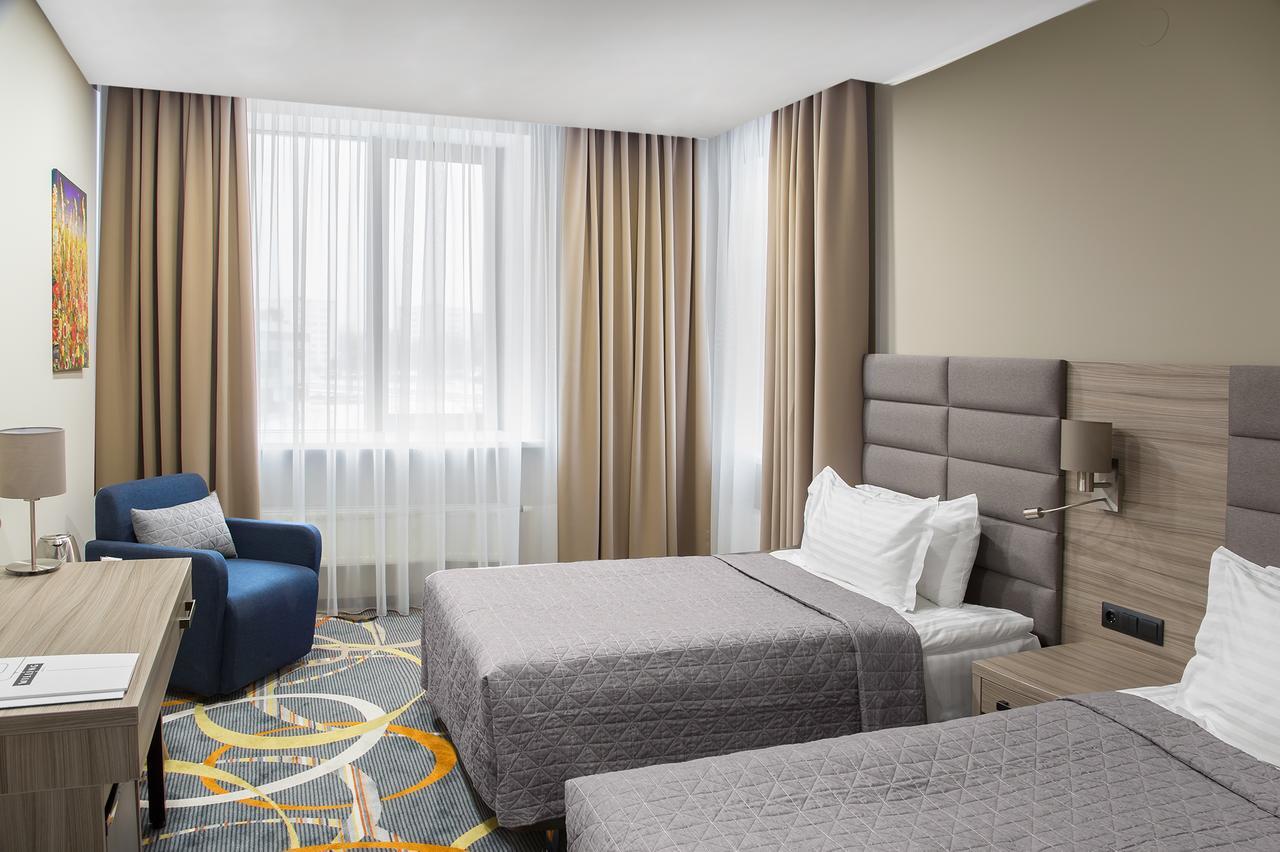 Willing Hotel Minsk Bagian luar foto